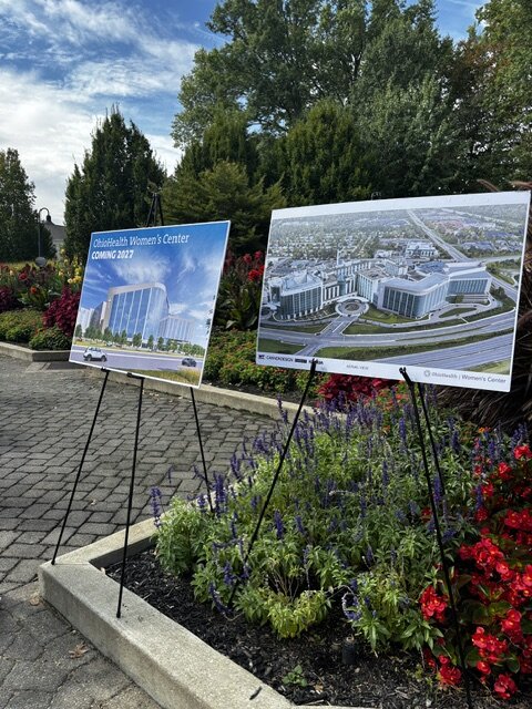 Architectural renderings of the OhioHealth Women's Center displayed on easels at the outing